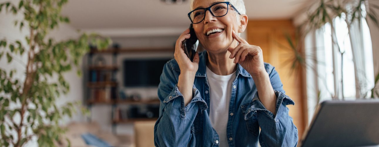 Mature woman, scheduling a meeting with her boss, at home office.
